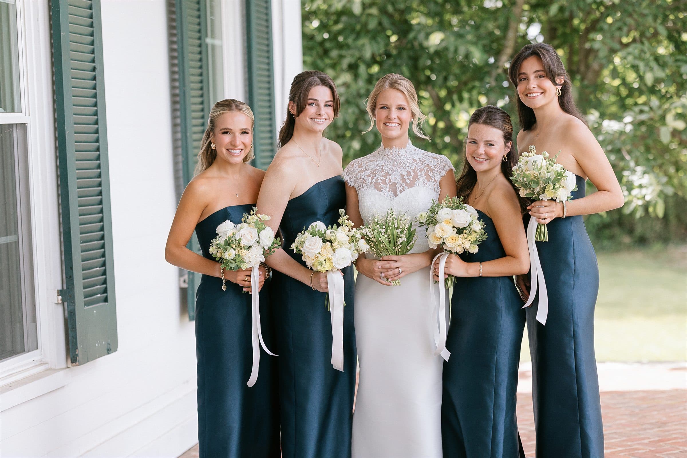 The bridal party in navy at the shutters