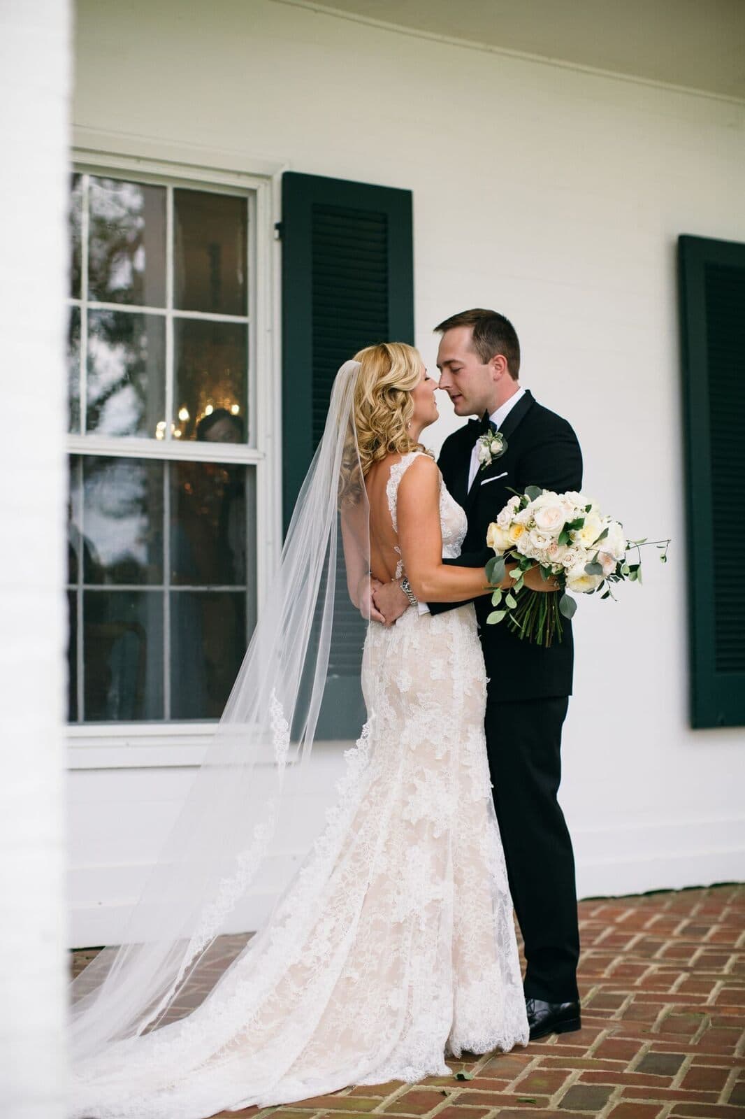 Newlyweds on the manor porch