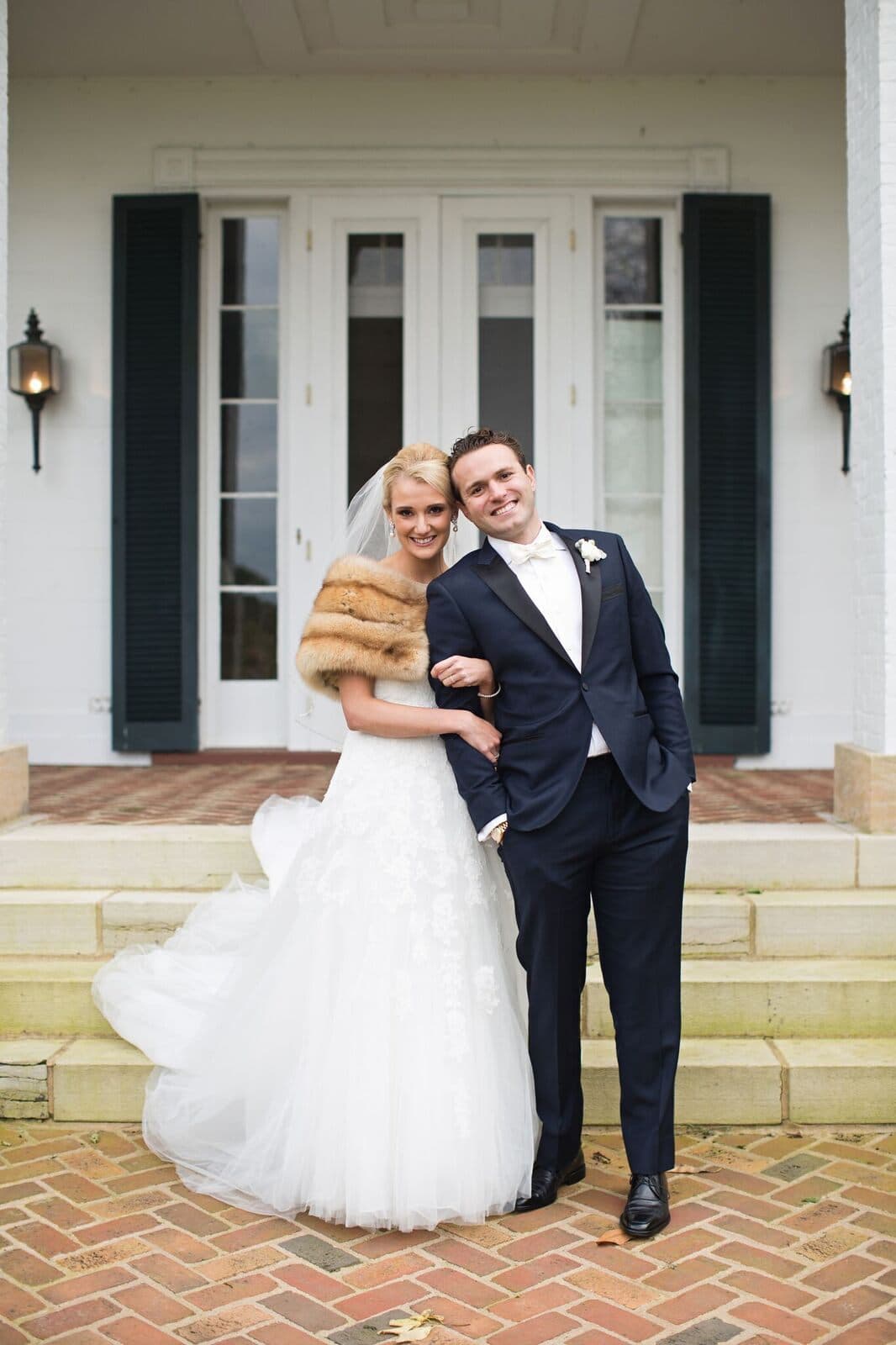A couple on the manor steps