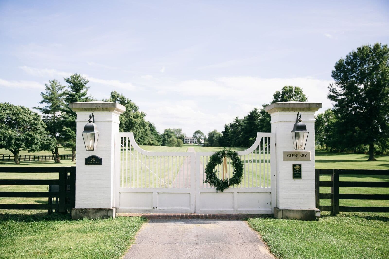 The white gates of the GlenLary Estate hung with a wreath