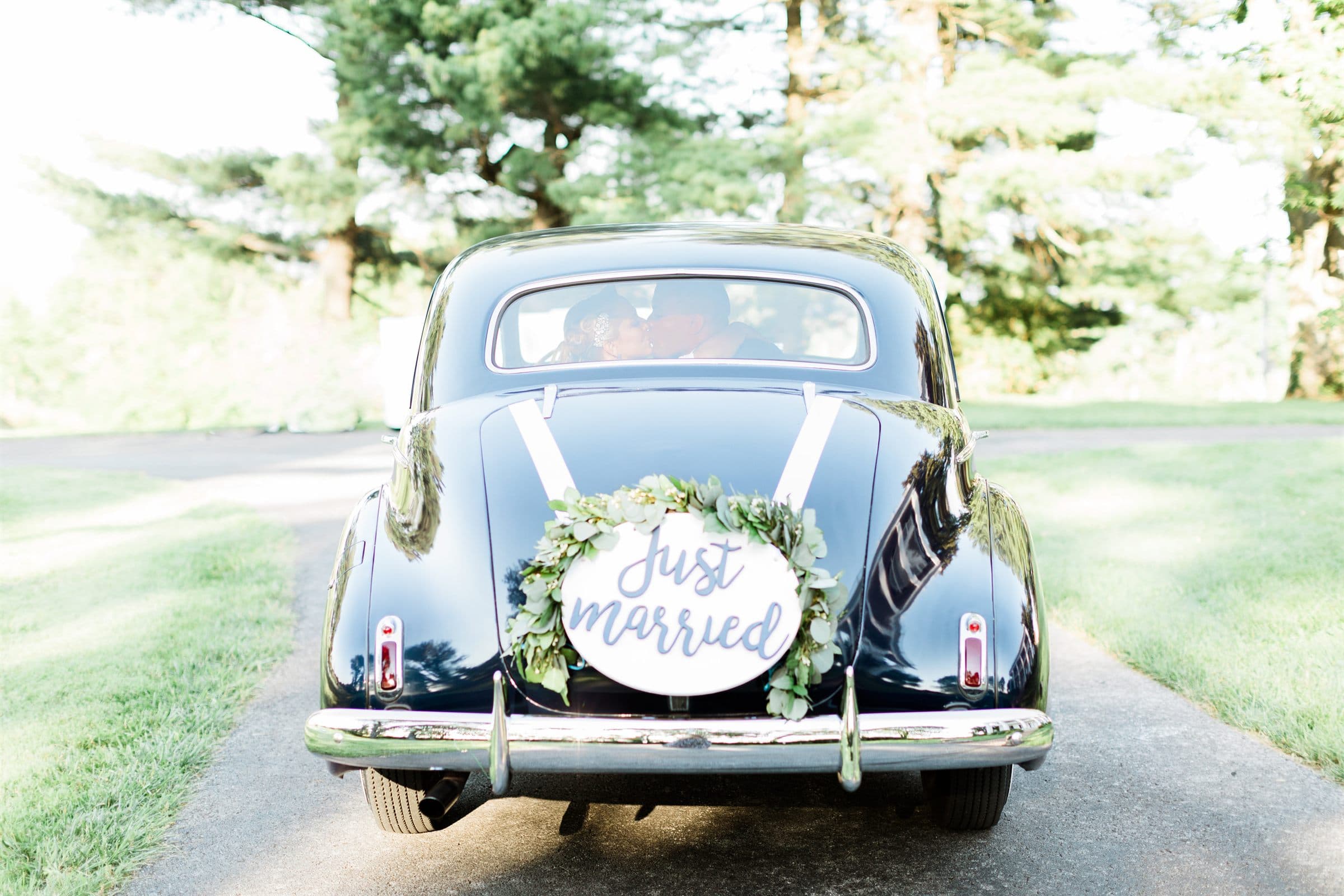 The just-married car heading down the drive