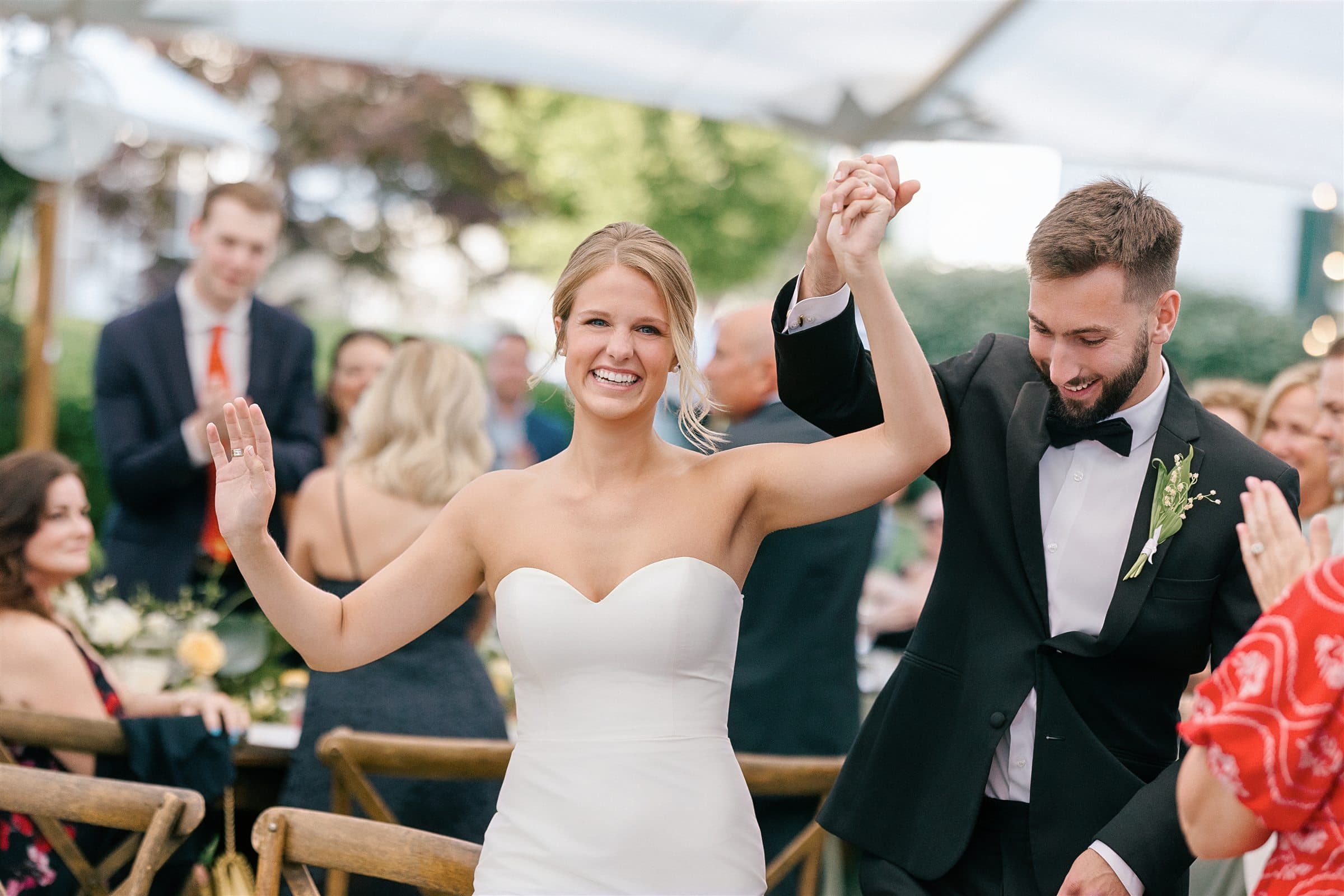 The couple applauding during the toasts